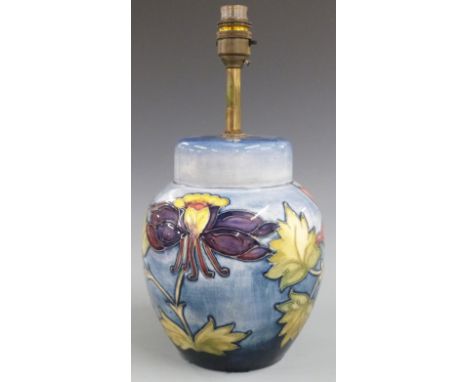 Moorcroft table lamp decorated in the Orchid pattern on a pale blue ground, H34cm