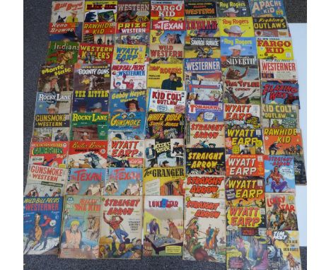 Sixty-four vintage cowboy and Western comics including Tim Tyler Cowboy, Wyatt Earp, Fighting Outlaws, Archie Kid, Silvertip,