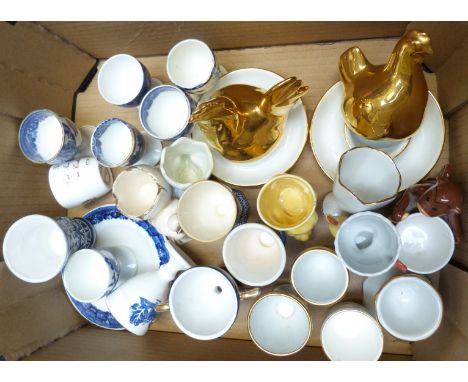Approximately 29 named novelty egg cups including Coalport, Royal Doulton, Delft, Royal Worcester, early blue and white, Vill