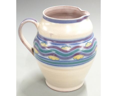 Carter Stabler Adams Poole pottery jug decorated with wavy landscape and cloud design, H20cm