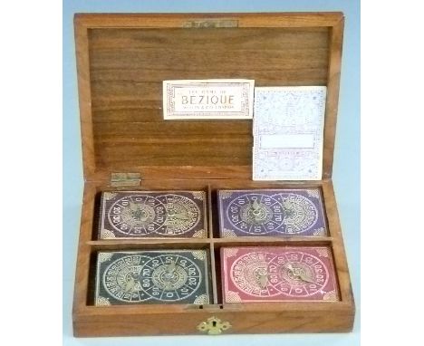 Willis &amp; Co. London boxed Bezique set, opening to reveal four packs of Willis square cornered playing cards and four Bezi