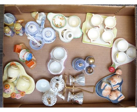 Approximately twelve novelty egg cruets including Goebel monkey, Japanese, salad ware etc, tallest 10cm