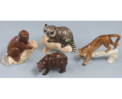 Beswick brown bear, racoon and beaver and a Goebel cougar, tallest 11cm