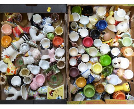 Approximately 80 novelty egg cups including kitsch, retro etc