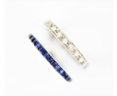 An untested sapphire set full eternity ring, designed as channel set, square cut sapphires, all set in white metal, with scro
