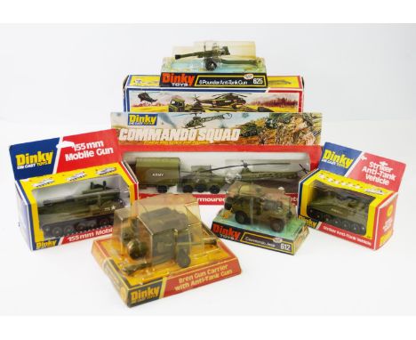 A collection of Dinky Toy military vehicles, comprising; a 618 Articulated Transporter With Helicopter, a 654 155mm Mobile Gu