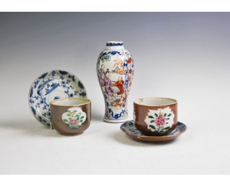 A pair of Chinese porcelain Batavian ware cups and saucers, decorated with a café au lait and reserves of floral sprays with 