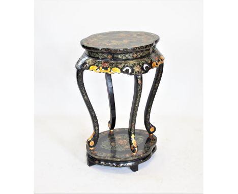 A Japanned black lacquer urn or lamp stand, 20th century, having a quatrefoil shaped top raised upon four curvilinear support