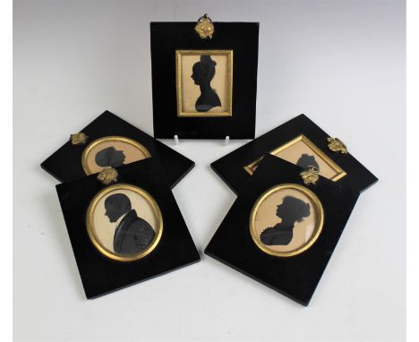 Five 19th century portrait silhouette miniatures, each mounted under glass in ebonised wooden frames with gilt details and gi