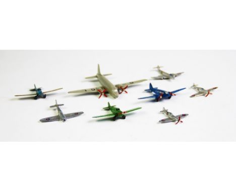 A collection of early Dinky Toy model aircraft, comprising a 62a Spitfire, a 62m Light Transport, a 62s Hurricane, a 70b Temp