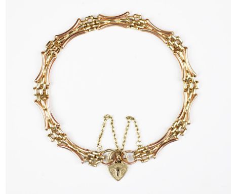 A 9ct bi-colour gold gate bracelet, of slender form and with attached padlock clasp, gross weight 8.9gms, within a fitted box