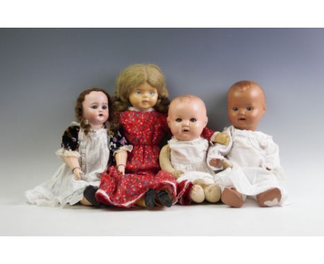 An Armand Marseille composition doll, stamped 'A&amp;M' with fabric body, 34cm long, a German bisque head doll stamped 'S&amp