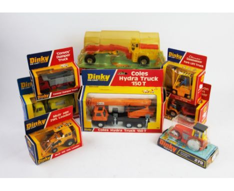 A collection of Dinky Toy construction vehicles, comprising; a 980 Coles Hydra Truck 150T, a 963 Road Grader, a 430 Johnson 2