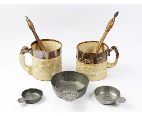 An 18th century pewter porringer, with decorative ear showing owners initials CRB, 14cm diam, with two smaller examples, two 