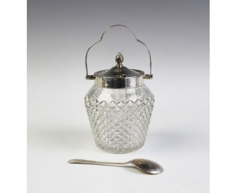 An Edwardian swing handled preserve jar, Birmingham 1904, the handle with pierced detail, with pine cone finial to the cover 