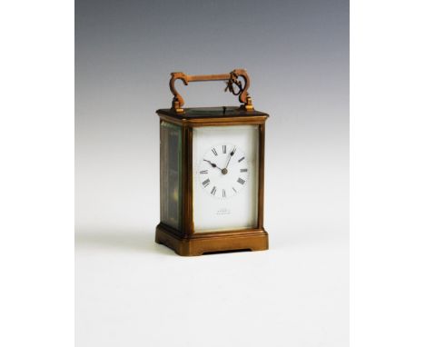 A late 19th century English brass cased repeating carriage clock by Prebble Folkestone, the brass case with swing handle abov