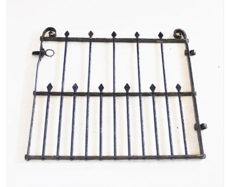 An early 20th century cast iron garden gate, with arrow head finials flanked by scroll terminals, 86cm H x 94cm W