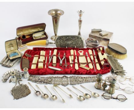 A selection of silver and plated items to include; a HMS weighted candlestick, HMS bud vase, two white metal chain link purse