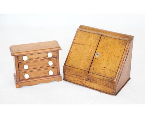 A Victorian pitch pine apprentice chest of three graduated drawers, each with ceramic handles, 29cm high, together with an ea