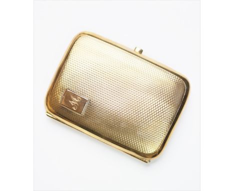 A 9ct yellow gold cigarette case, Birmingham 1926, of rounded rectangular form, with engine turned decoration, monogrammed 'M