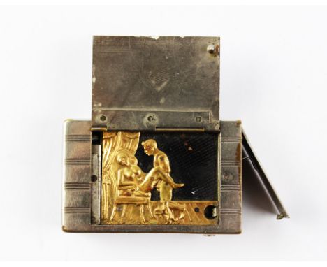 A late 19th nickel plated erotic automaton vesta case, the rectangular case with engine turned exterior opening to reveal a g