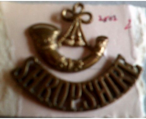 British WWI Shropshire Light Infantry brass shoulder title and bugle device. 
