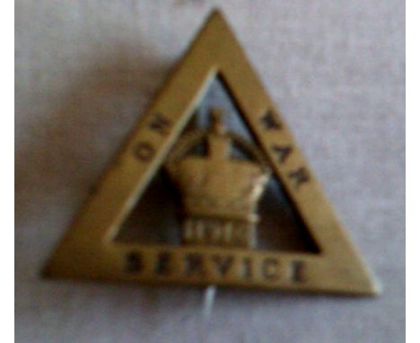 British WWI On War Service badge, This triangular shaped badge issued after conscription in 1916 by the Ministry of Munitions