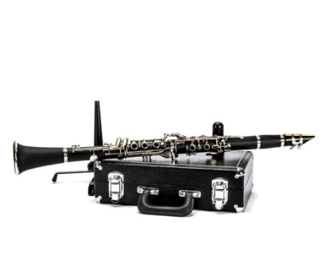 Clarinet, a cased modern black clarinet in very good condition with a stand 