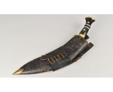 A Vintage Indian Kukri Knife in Leather Scabbard, Blade Stamped for the Military Supply Syndicate