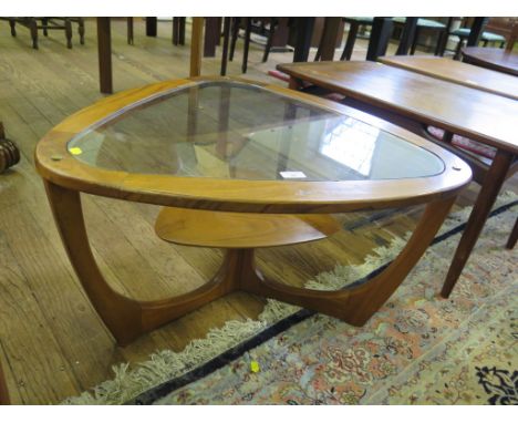 Vintage teak framed coffee table, triangular shape with glass top and teak shelf below