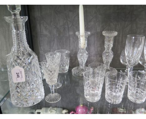 A Waterford crystal decanter and stopper, 34cm high, a pair of Waterford candlesticks, a pair of champagne flutes and various