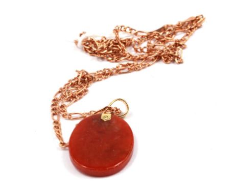 A small jade pendant on fine 9 carat gold neck chain