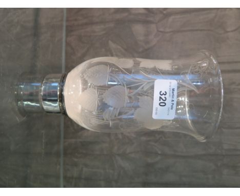 A silver candlestick with a glass shade and snuffer, Birmingham 1974