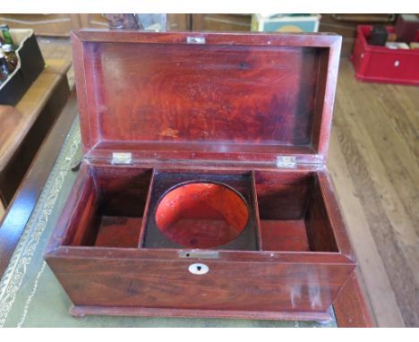 An early 19th century mahogany sarcophagus form tea caddy on pad feet, 31cm wide