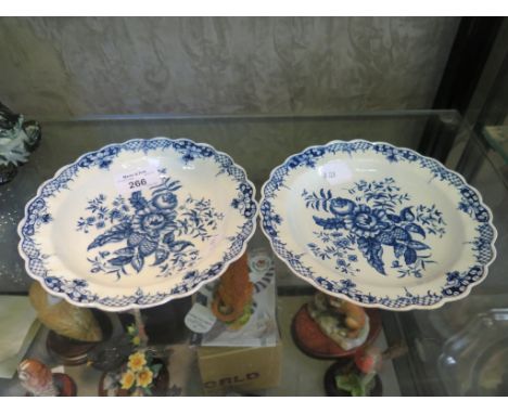 A pair of Dr Wall period Worcester blue and white plates, with scalloped edges and floral and cone printed decoration, one wi