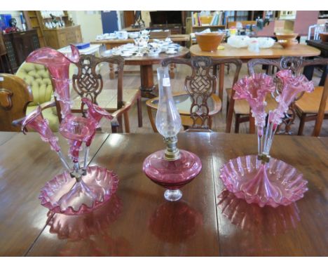 A Victorian cranberry glass Epergne, with four trumpet vases over a wavy bowl 48cm high, another similar, as found (two vases