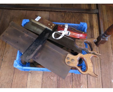Various woodworking tools, including leather covered tape measure, hand drills, squares and saws