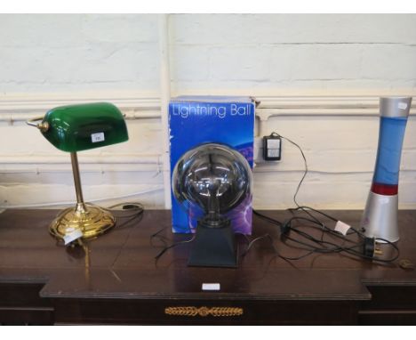 A brass and green glass club table lamp, 38cm high, a lava lamp and a lightening ball (3)