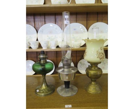 A Victorian brass oil lamp with thistle decoration, 32cm high and two other oil lamps (3)