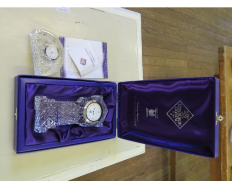 An Edinburgh Crystal Millennium Collection quartz timepiece, in the form of a longcase clock, boxed, 19cm high, and another E