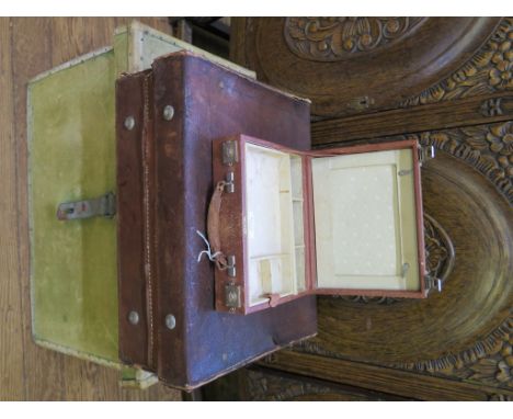 A canvas lined fitted trunk, with P&O labels from Bombay to London, 61cm wide, a leather dressing case and a leather jeweller