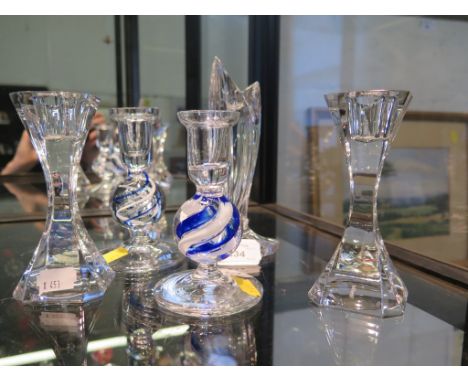 A Waterford Marquis crystal glass candlestick together with a pair of squat blue and white ribbon stemmed candlesticks and a 