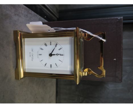 A brass carriage clock by William Widdop, single train movement 14cm high, in original box