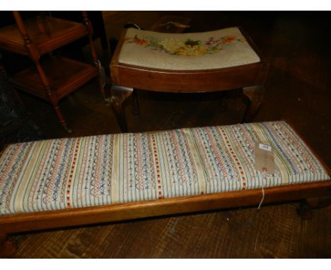 An early 20th century oak low stool, having a tapestry woven stuff over top raised on squat cabriole legs, pad feet, together