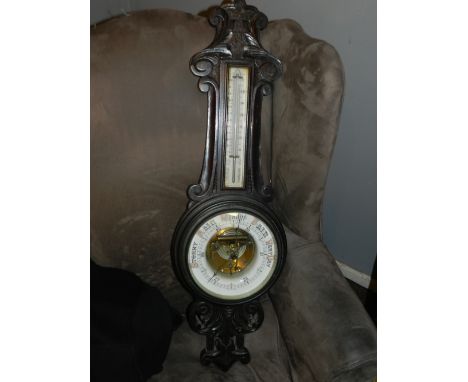 Late 19th/early 20th century barometer, having carved scroll decoration. 