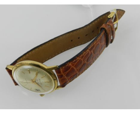 Mathey-Tissot & Co., SA. A mid 20th century gentleman's yellow metal dress watch, having a champagne baton dial with date ape