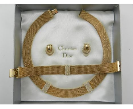 Christian Dior. A set of jewellery, including a yellow metal and diamante necklace, together with a matching bracelet and ear