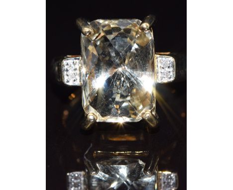 A 9k gold ring set with idocrase and diamonds, size N, 7.2g