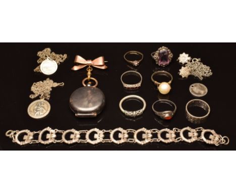 A collection of silver jewellery including six silver rings, St Christopher, bracelet with claddagh links, sovereign holder &