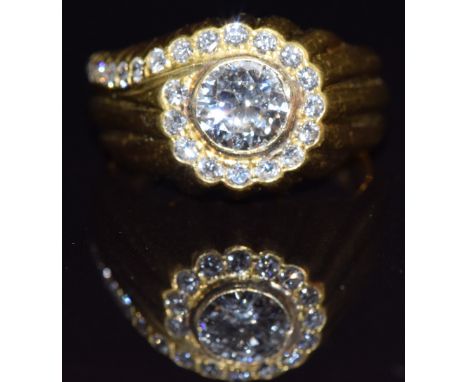 An 18ct gold ring set with a diamond of approximately 0.7ct&nbsp;surrounded by further diamonds, size O, 8.2g